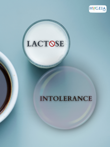 cup of milk with a text saying lactose and a bubble saying intolerance close to a cup of coffee on a blue background