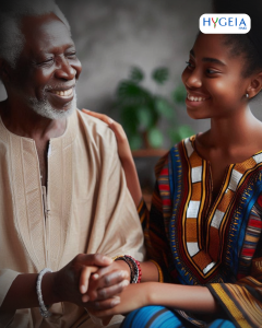 An elderly black person with a black family member, smiling and engaging in a supportive manner, wearing traditional African attire to show bladder incontinence
